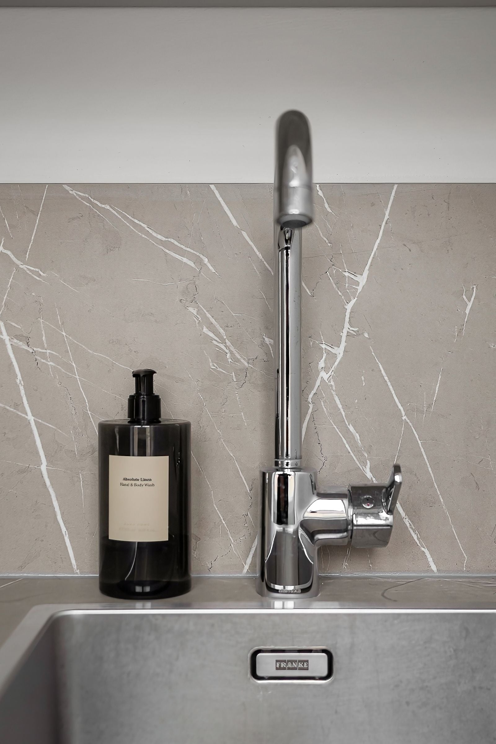 Modern kitchen sink scene for cleaning tablets around the home